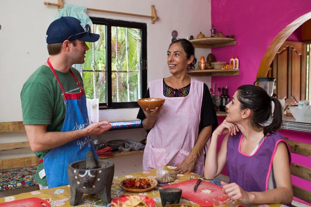 a group of people standing in a kitchen