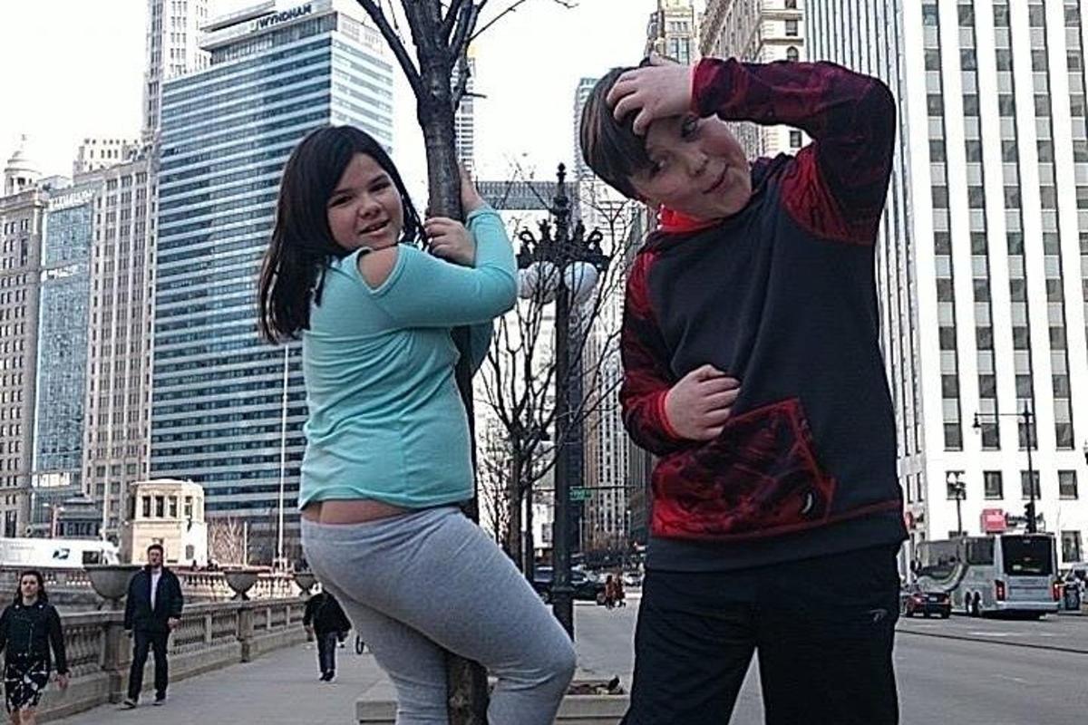 a man and a woman dancing in a city