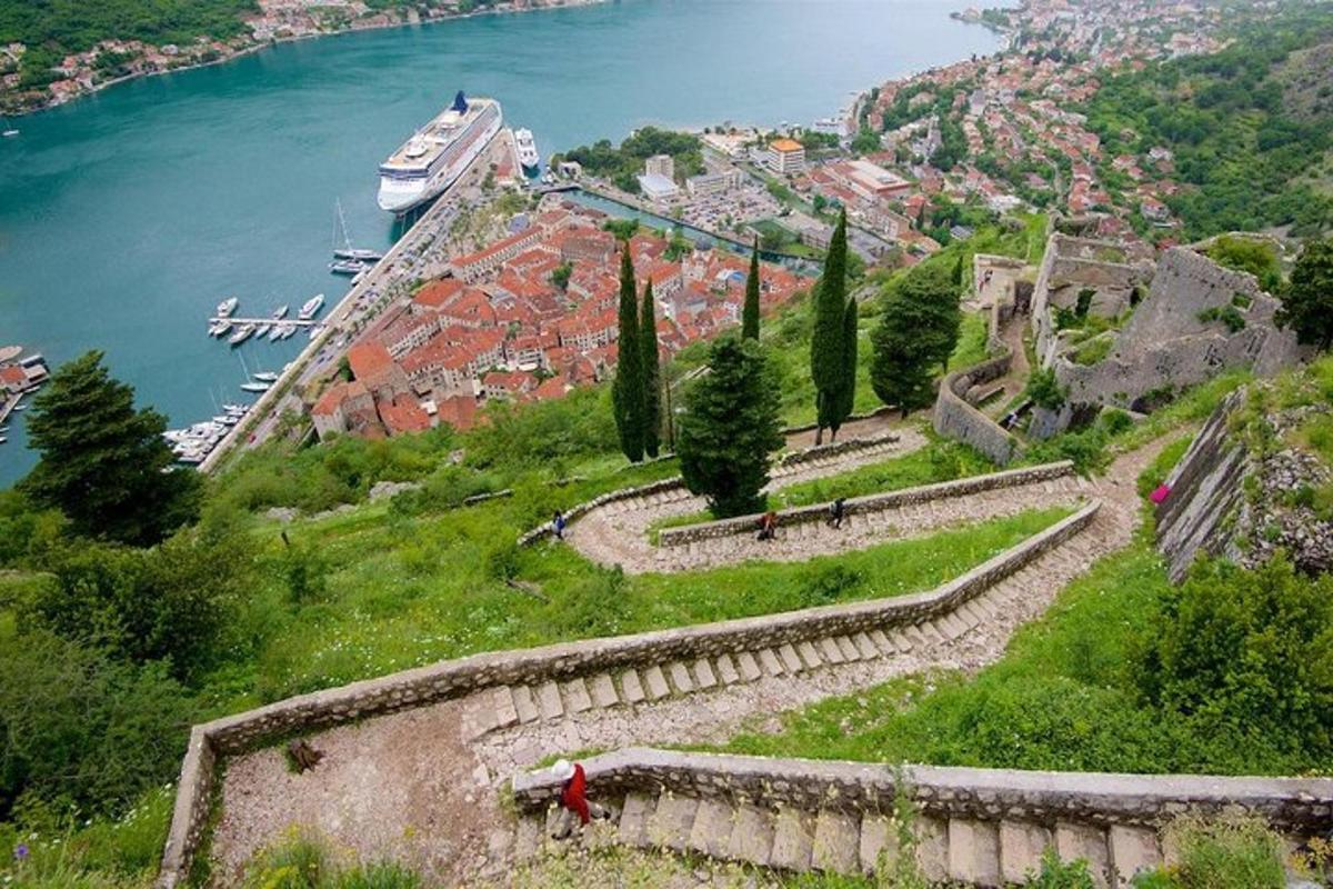 a boat is on a hill next to the water