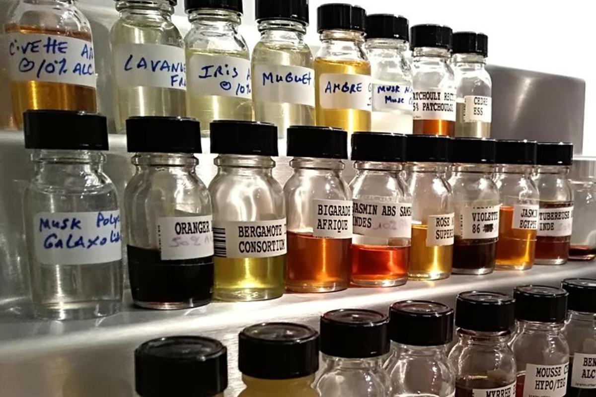a refrigerator filled with lots of bottles of honey
