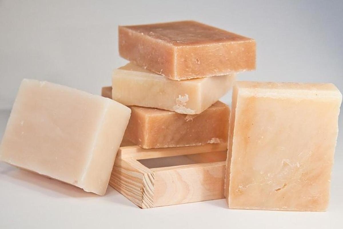 a pile of four pieces of soap on a white background
