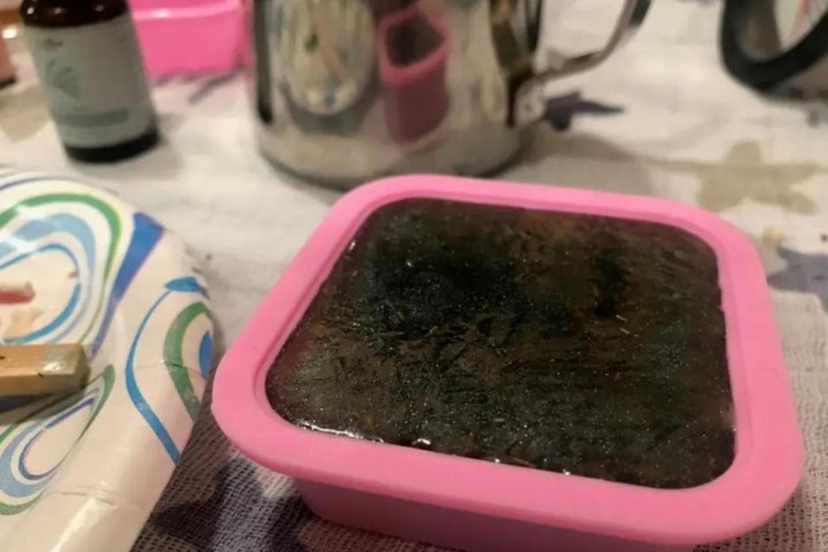 a pink container sitting on top of a counter