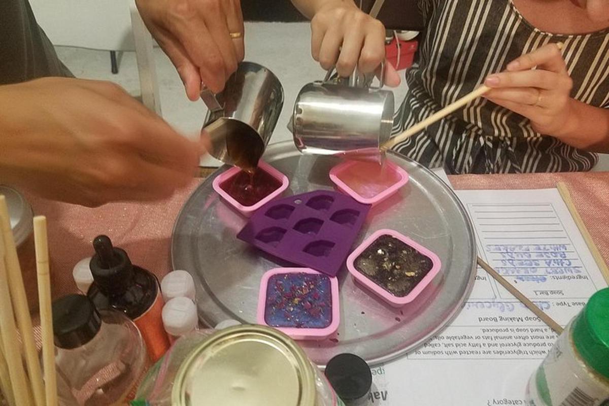 a group of people pouring paint onto a table