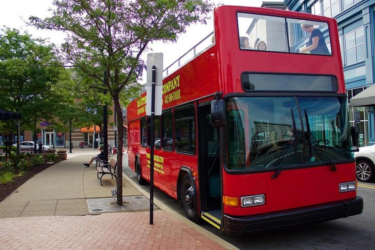 a red double decker bus parked on a street