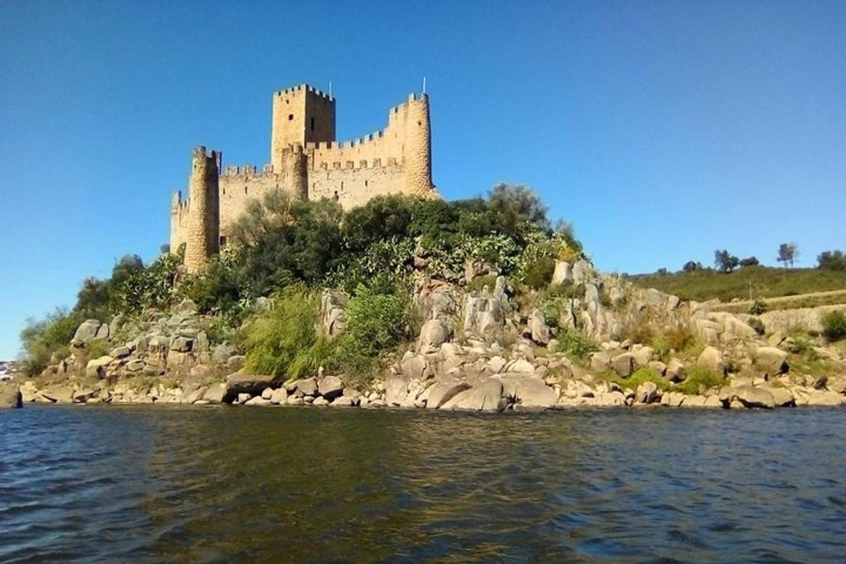 a castle sitting on top of an island in the water
