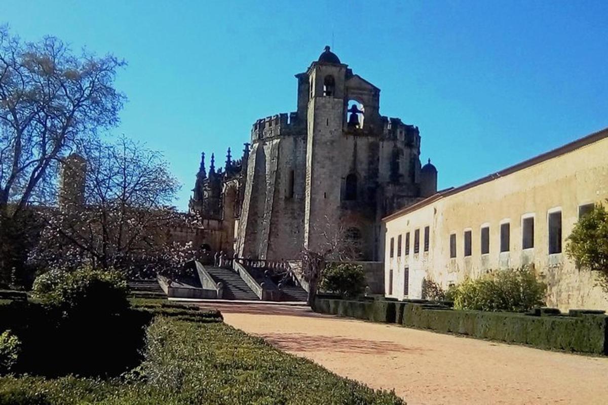 a large building with a tower in the background