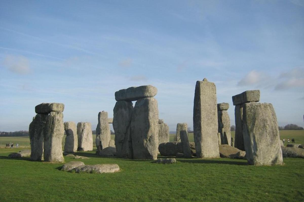a group of stonehenge stones in a field