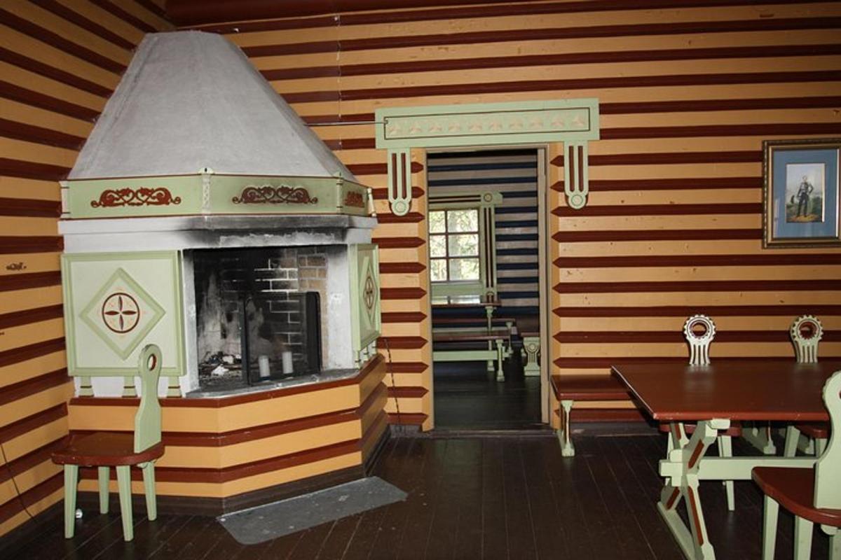 a room with a fireplace and a dining room with a table