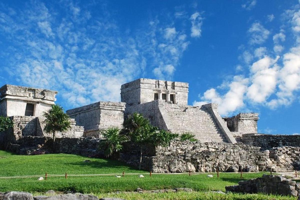 an old castle on a hill with a blue sky