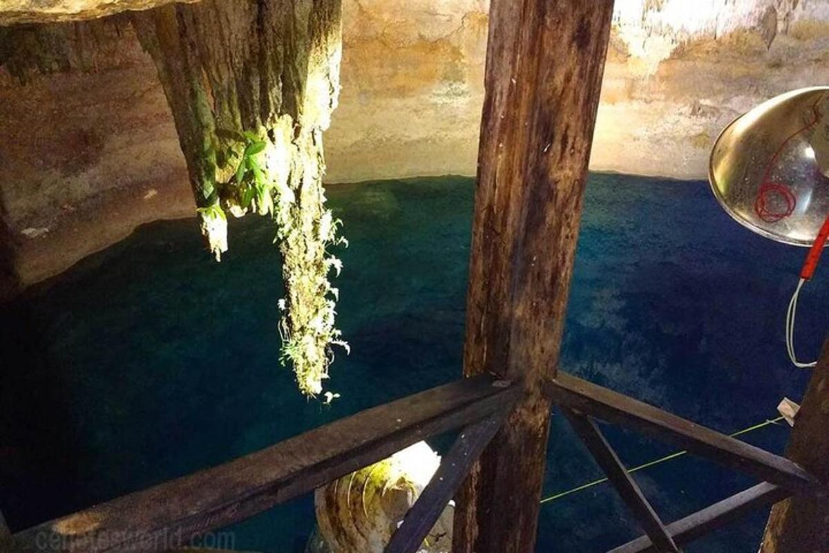 a view of the water from the inside of a cave