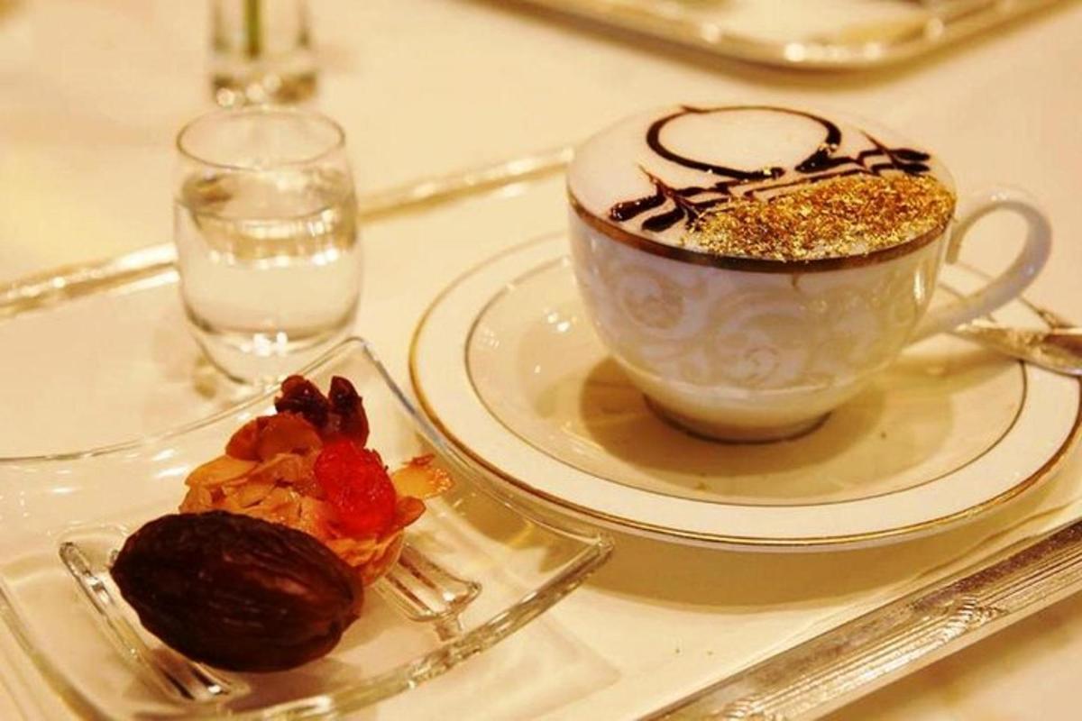 a cup of coffee and a plate of food on a table