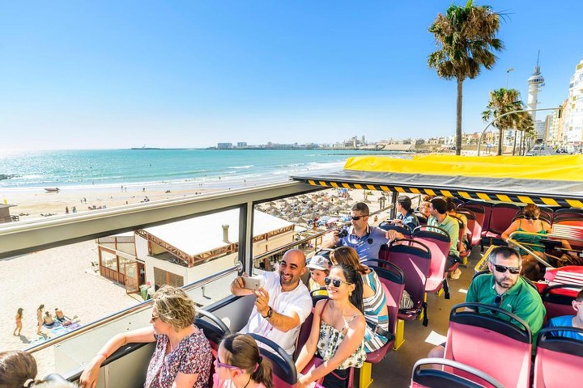 a group of people riding on a tram at the beach