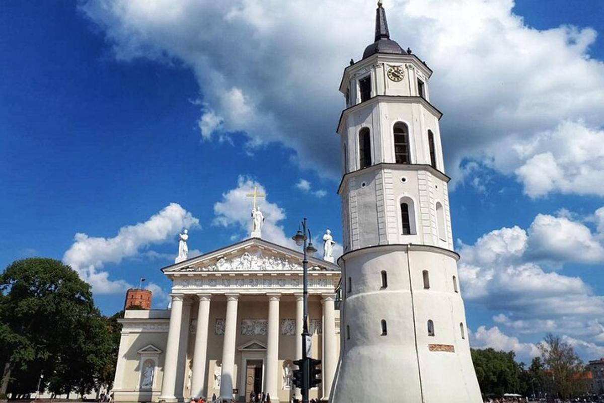 a white building with a clock tower in front of it