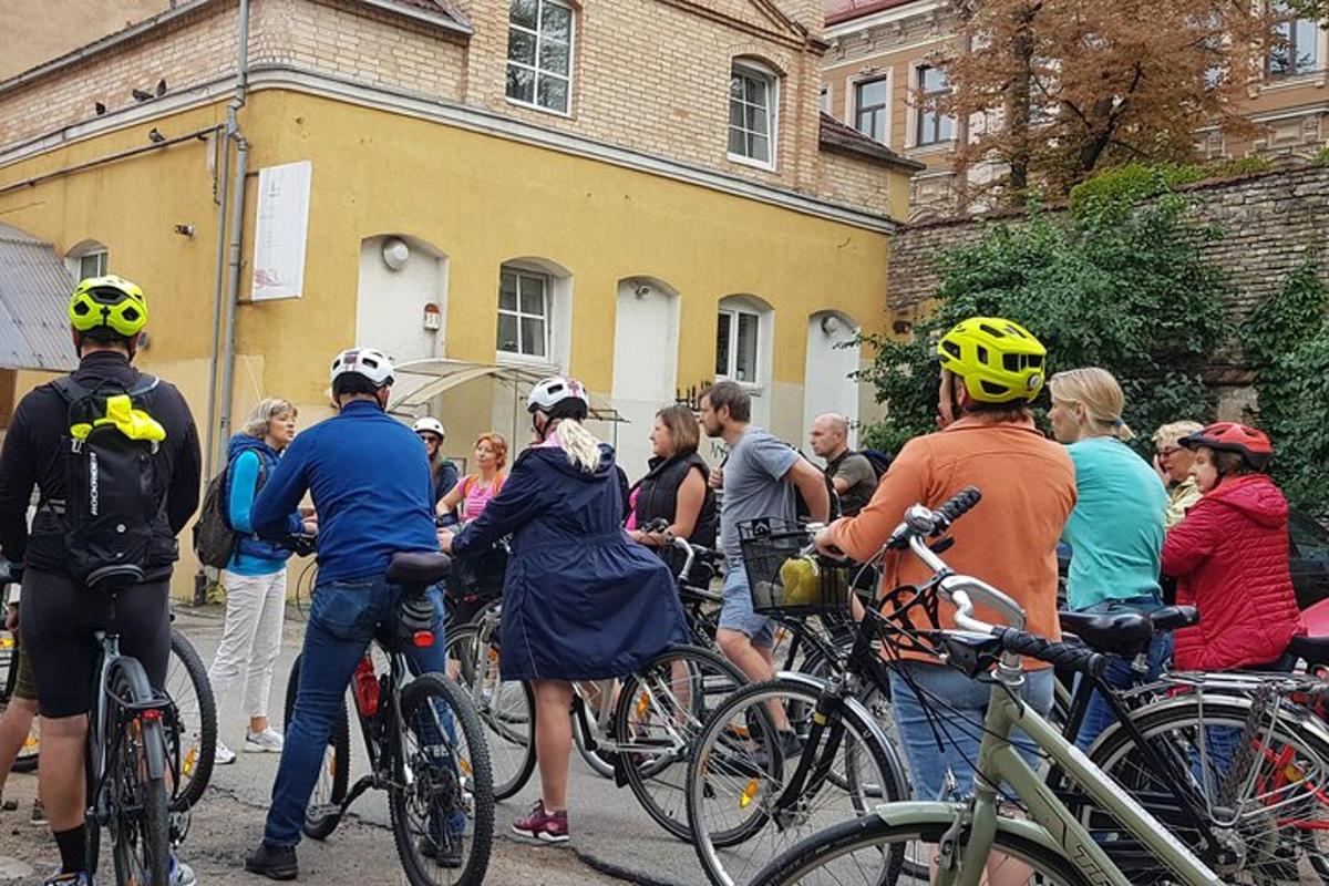 a group of people standing around with their bikes