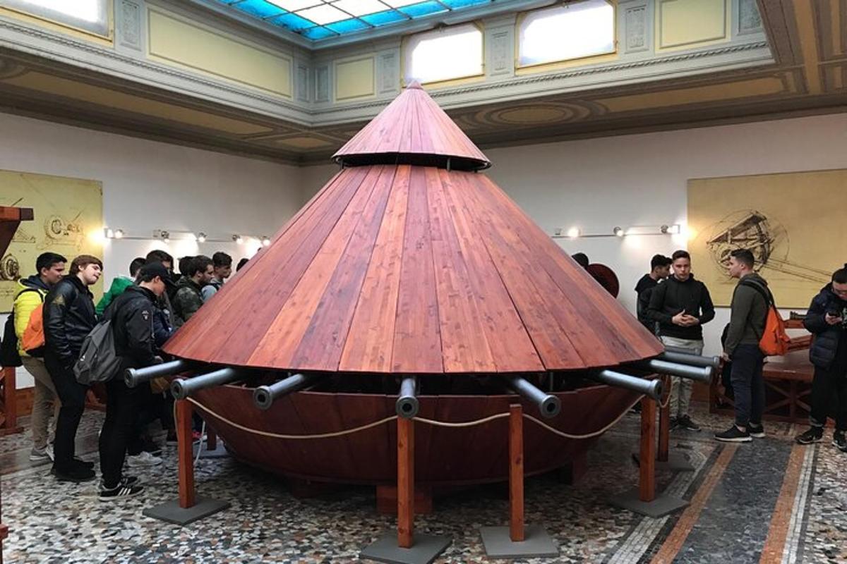 a large wooden table in a room with a group of people
