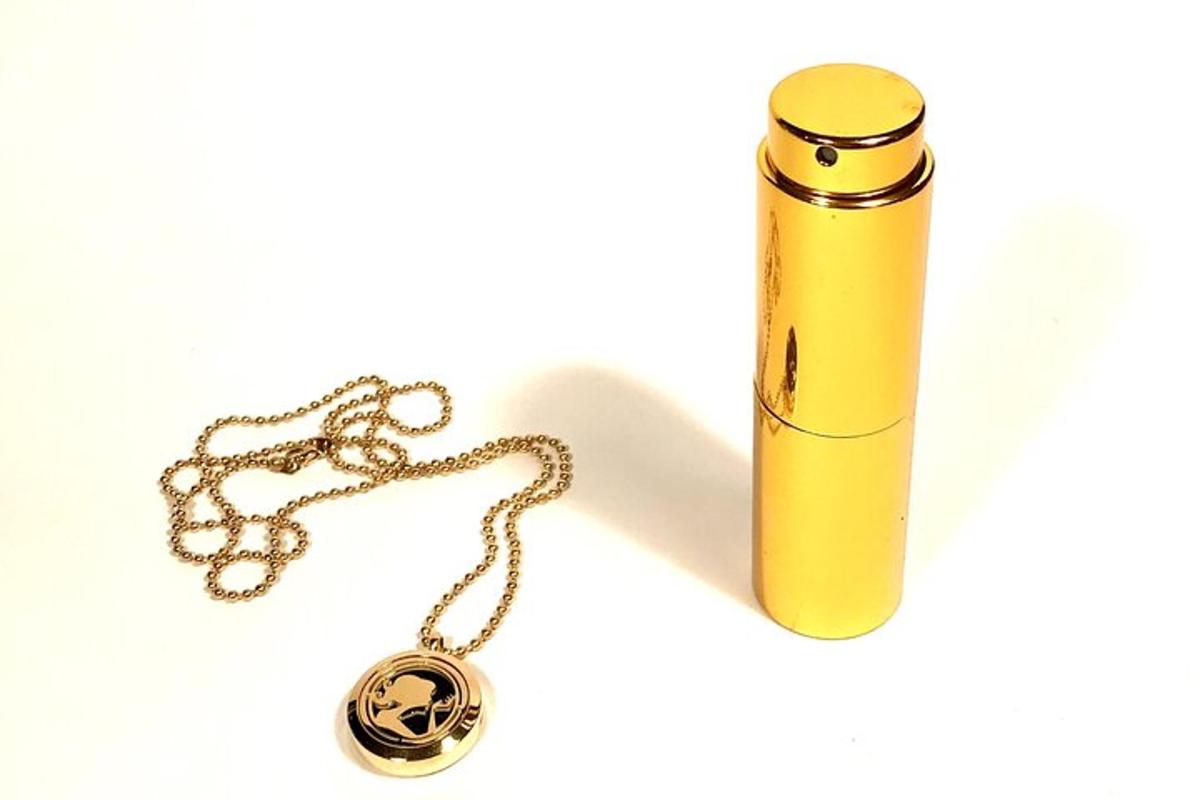 a yellow lighter and a necklace on a chain