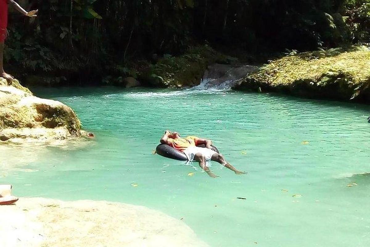 a person laying in the water in a river