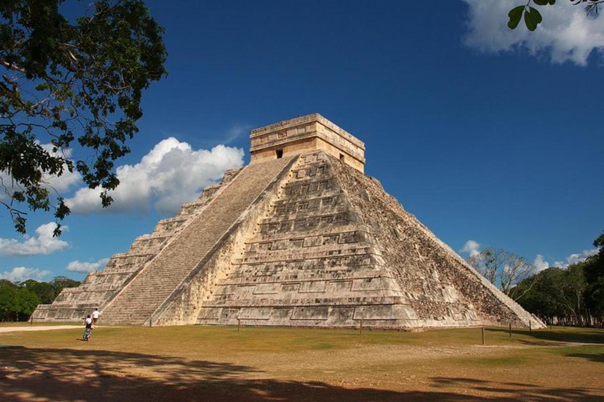 a person standing in front of a pyramid