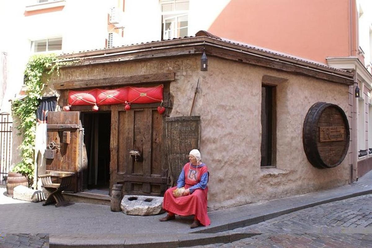 a woman sitting on the side of a building