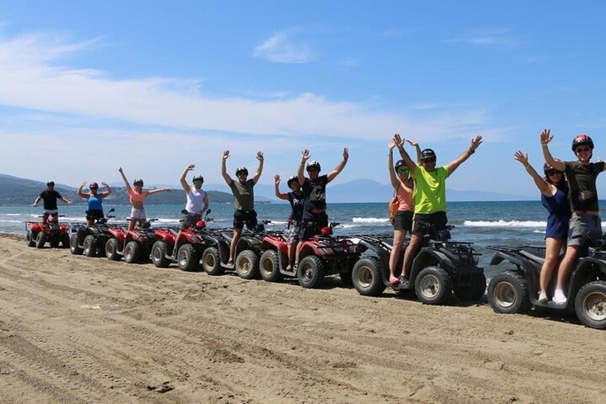 a group of people on atvs on the beach
