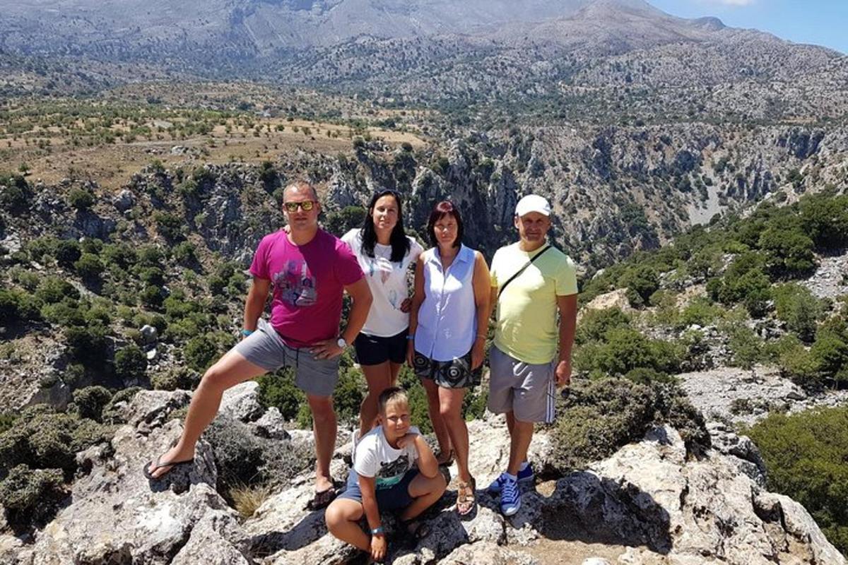 a group of people standing on top of a mountain