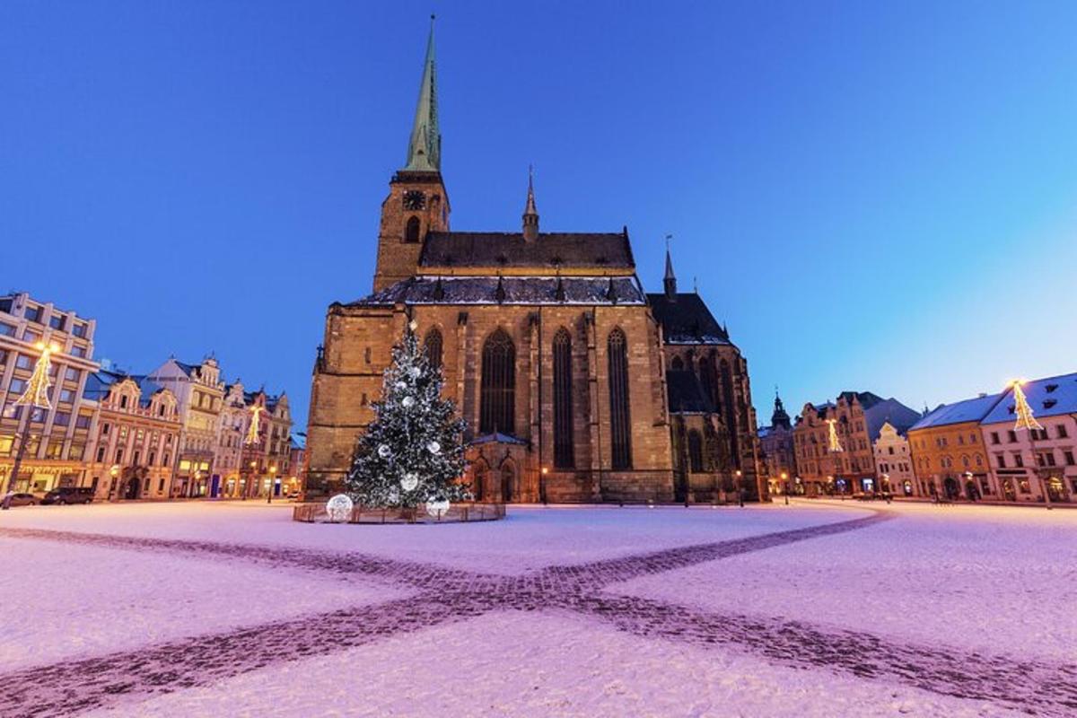 a christmas tree in front of a large building