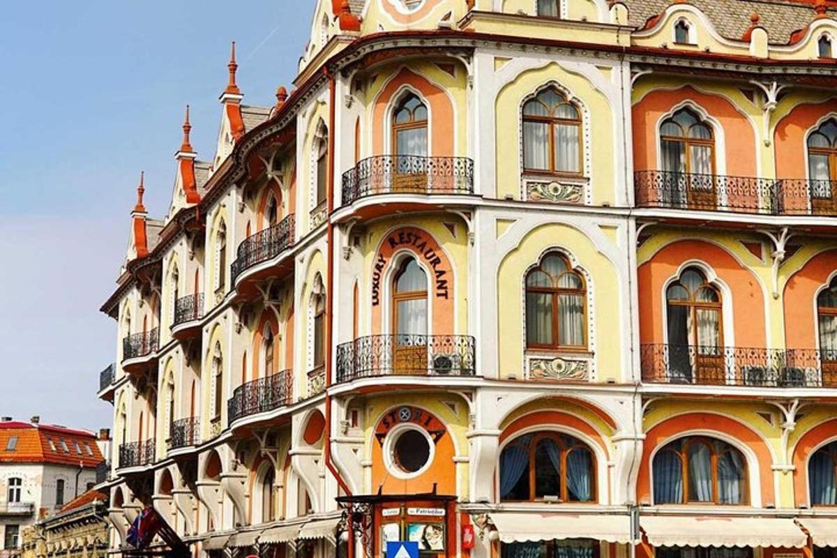 a large yellow building with a lot of windows
