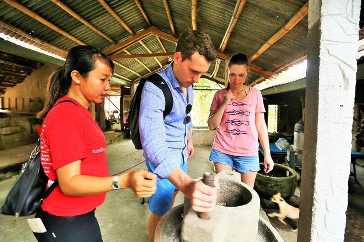 a group of people looking at something in a barrel