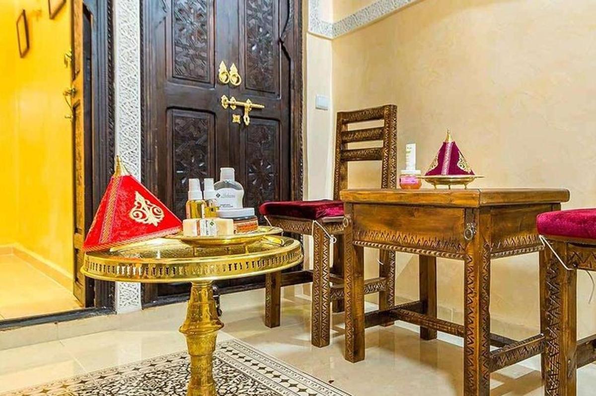 a room with a table and chairs and a door