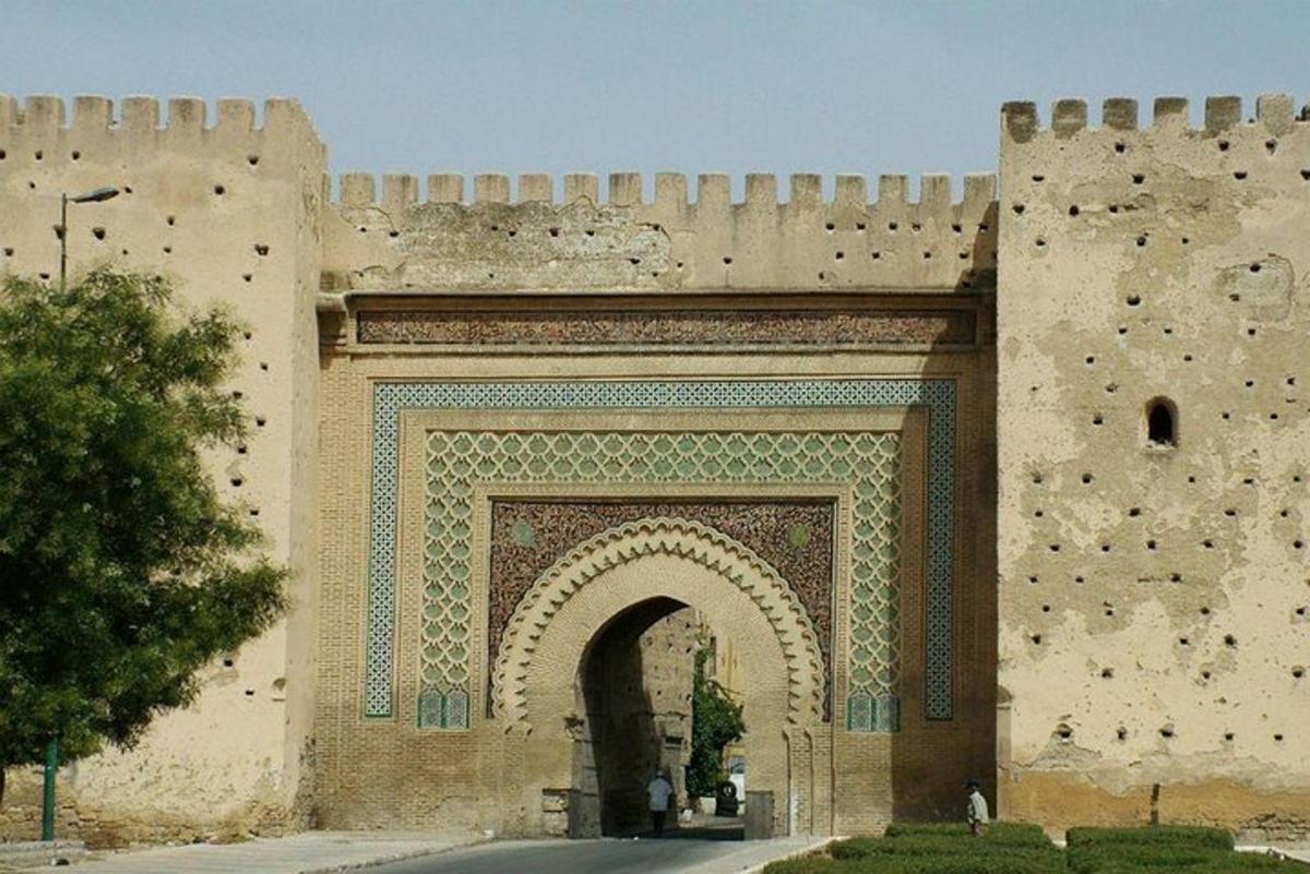 a building with an arch in front of it