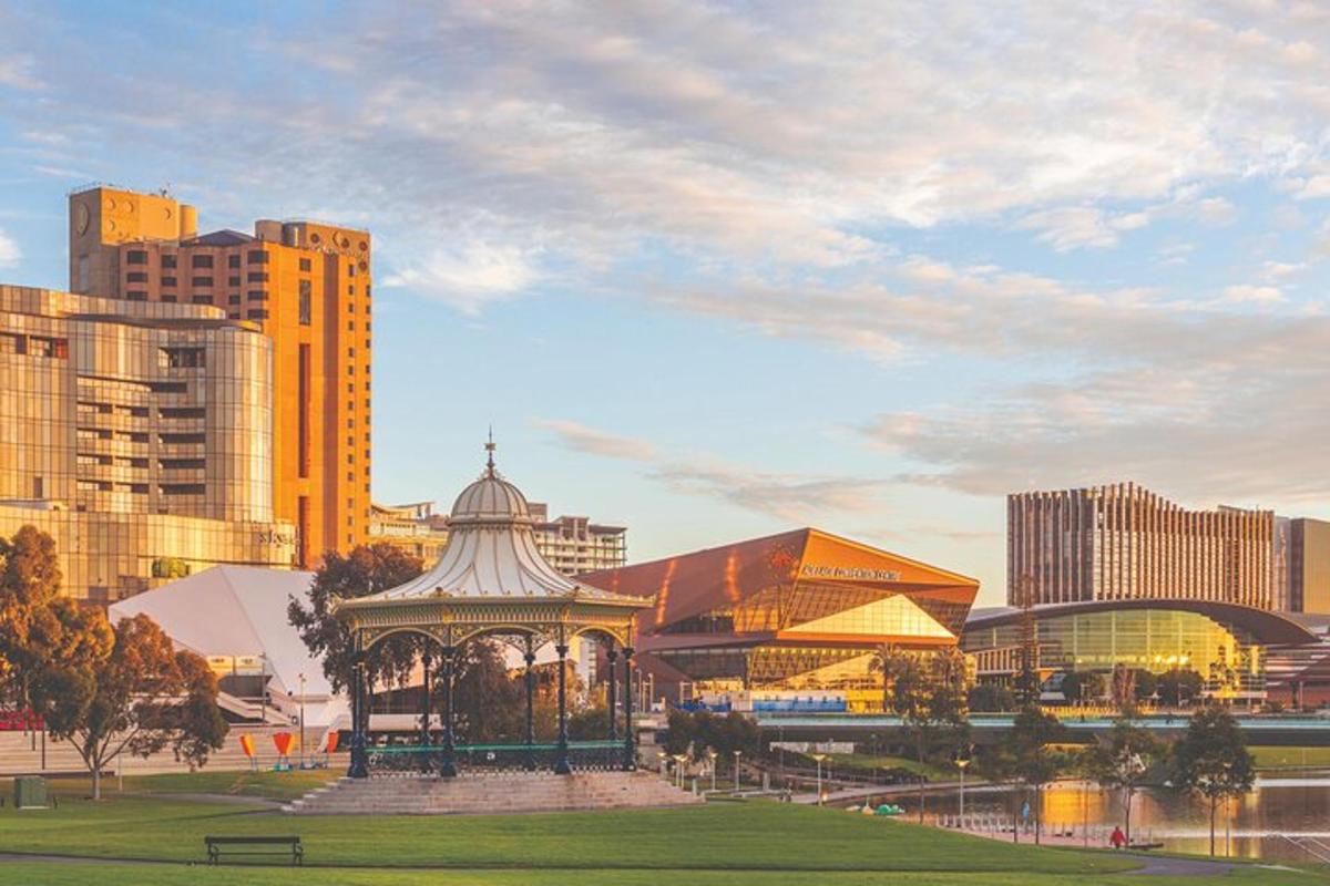 a park with a gazebo in the middle of a city