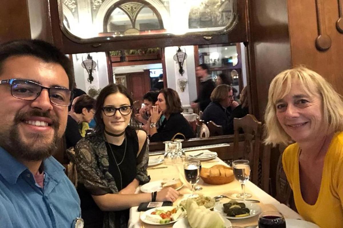 a group of people sitting at a table in a restaurant
