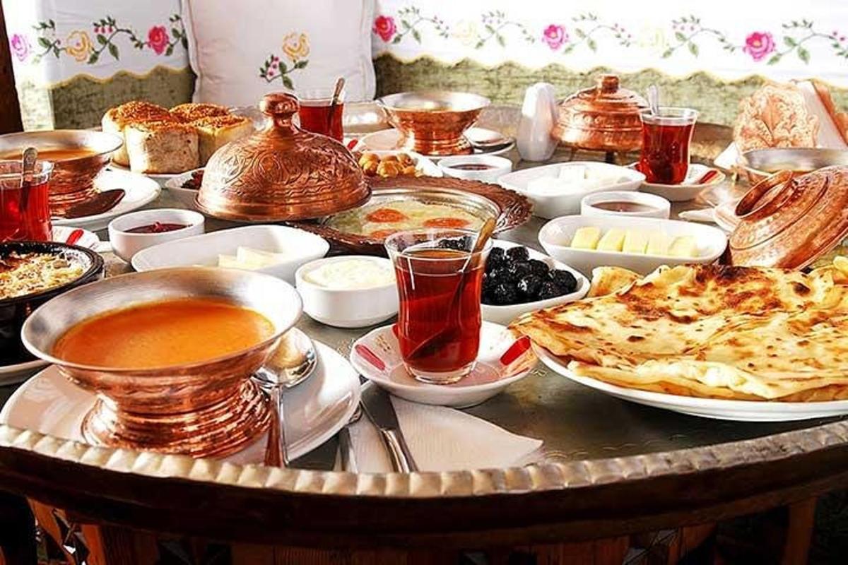 a table full of food and drinks on a table