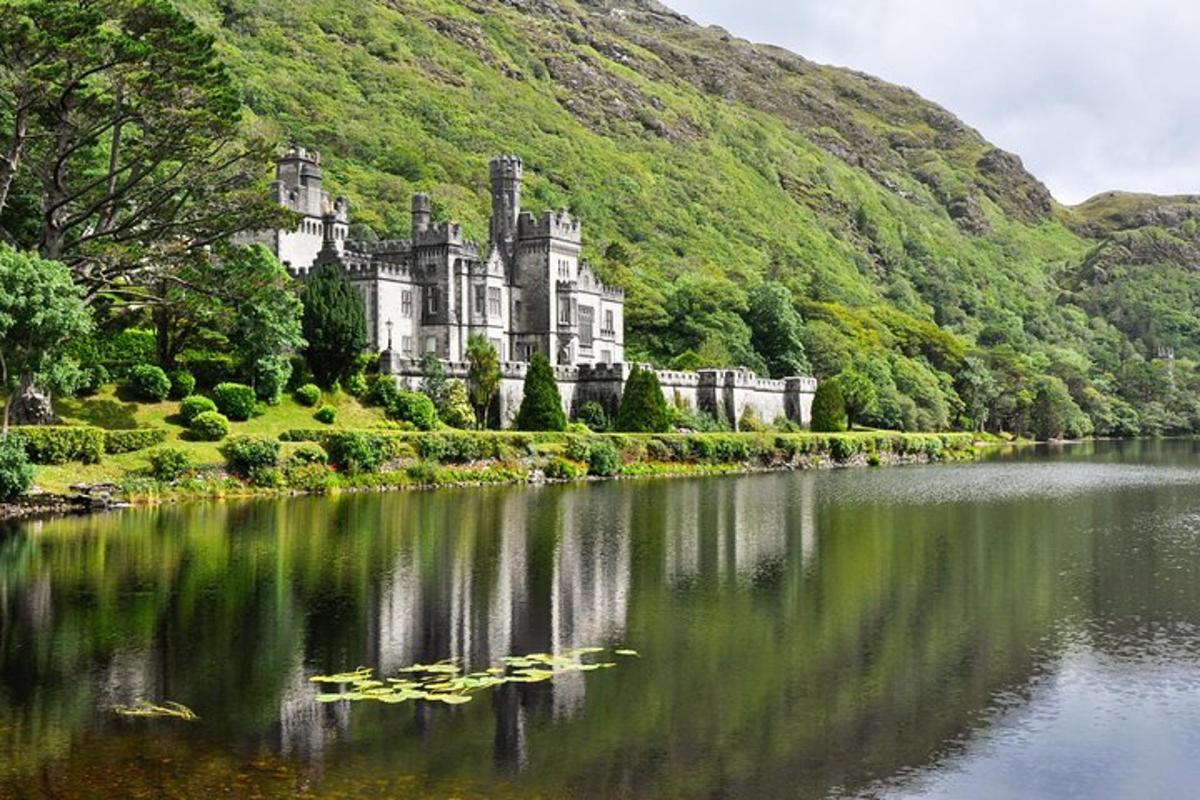 a castle sitting on the side of a lake
