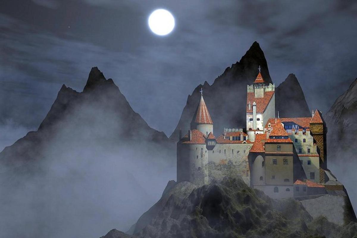a castle on a mountain with the moon in the sky
