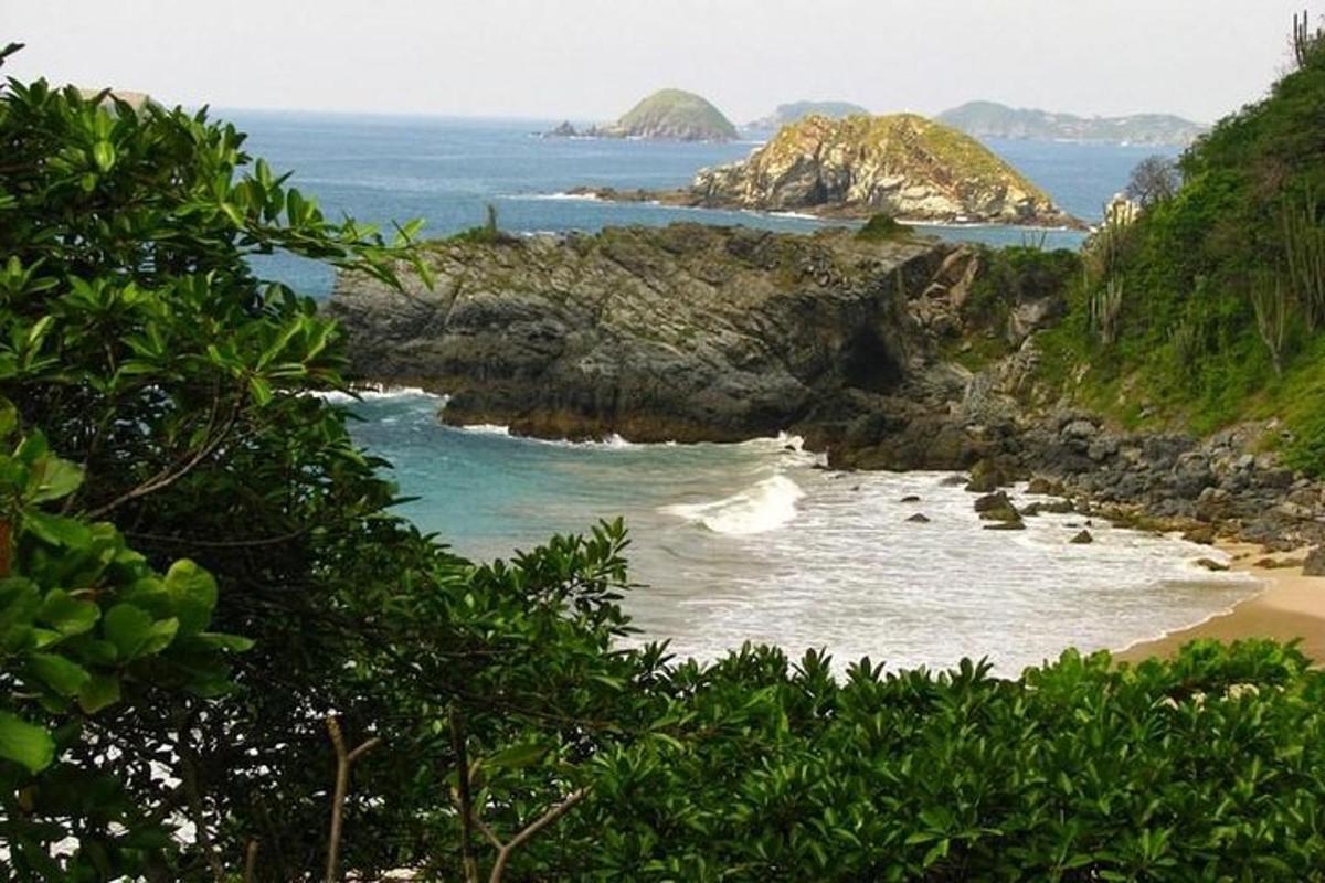 a view of a beach with rocks and the ocean
