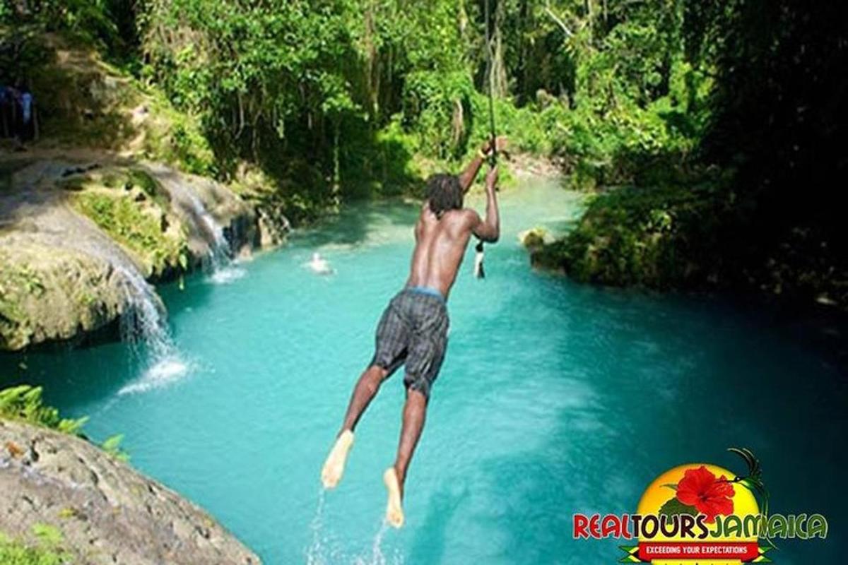 a man jumping into a river in the water