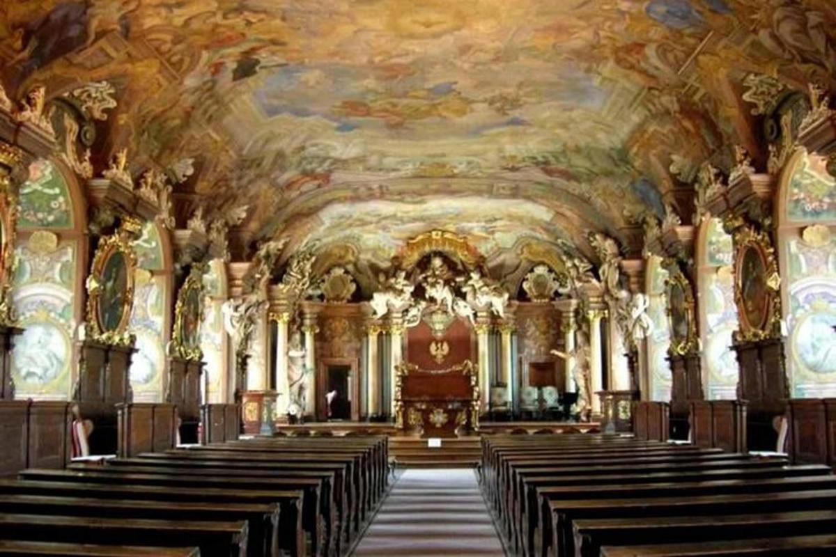 a large church with a row of pews in it
