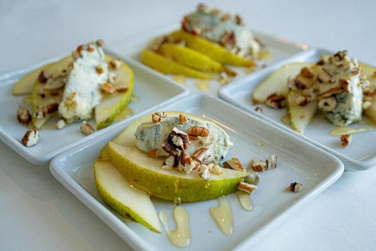 three plates of food with apple slices and nuts
