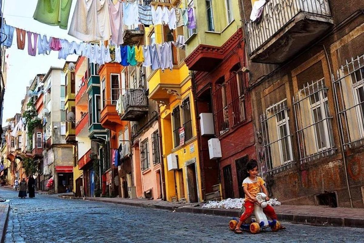 a young boy riding a skateboard down a street