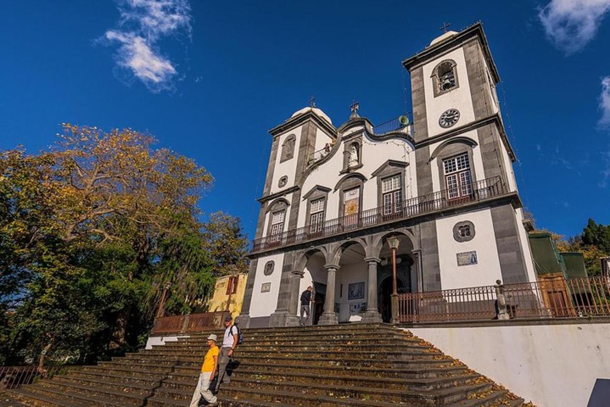 a large white building with stairs in front of it