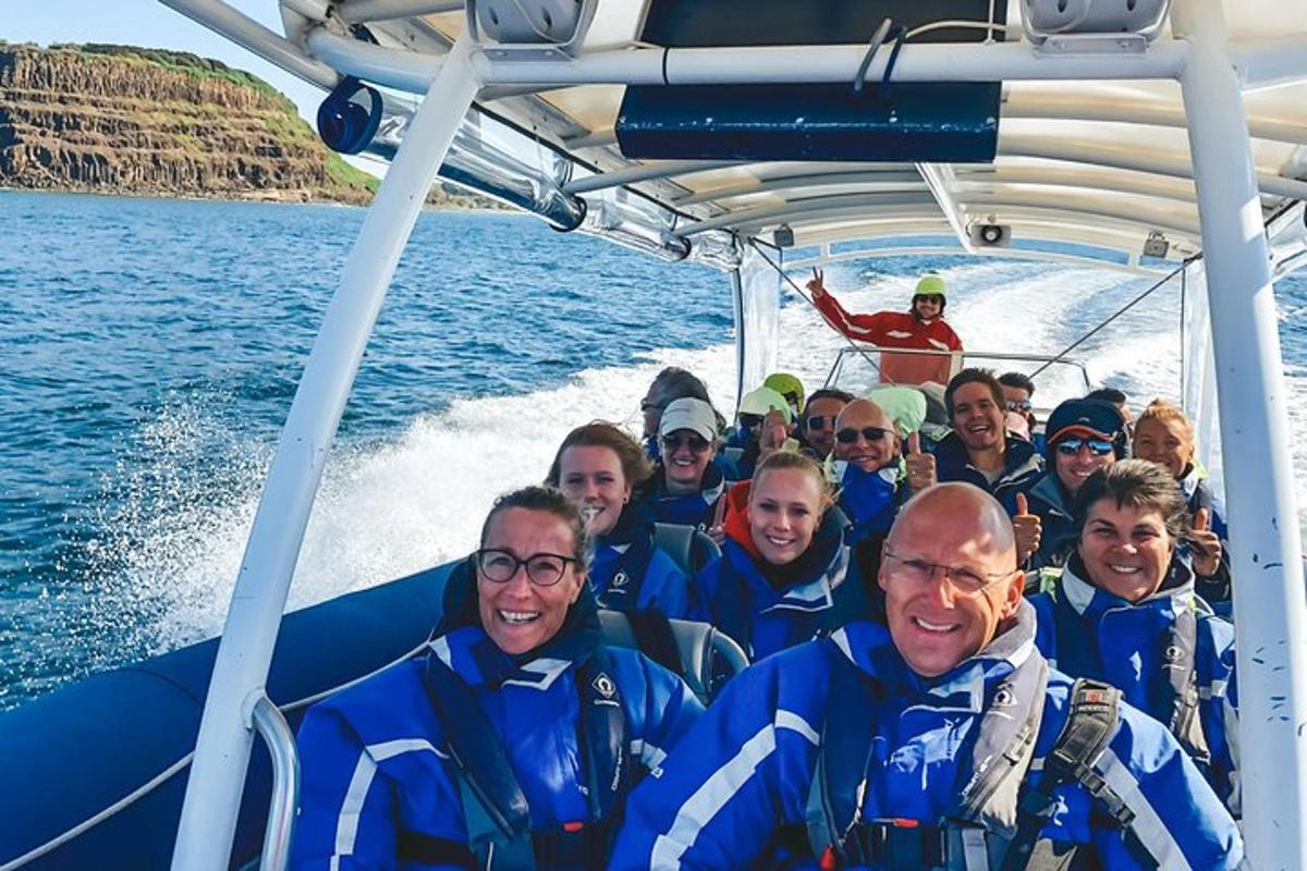 a group of people on a boat in the water