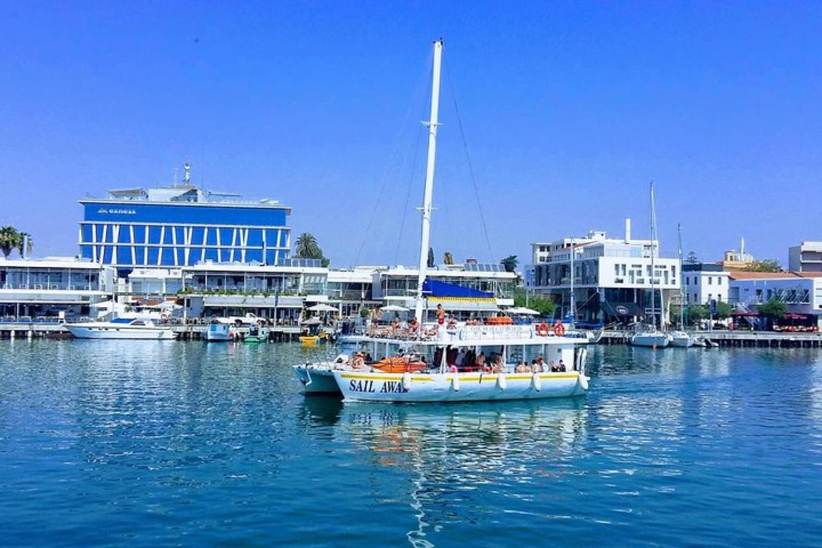 a boat in the water near a harbor with buildings