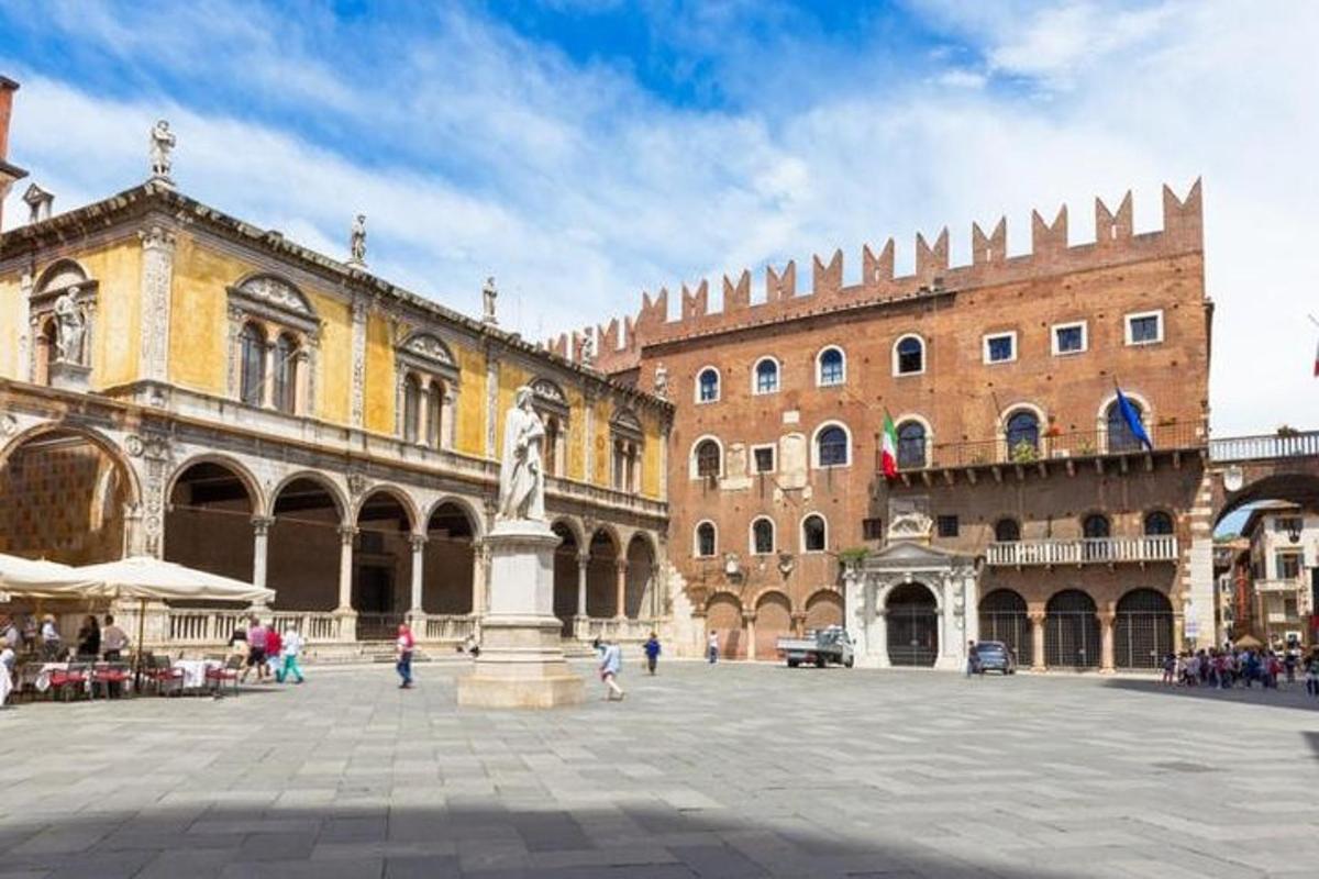 a city square with a statue in front of a building