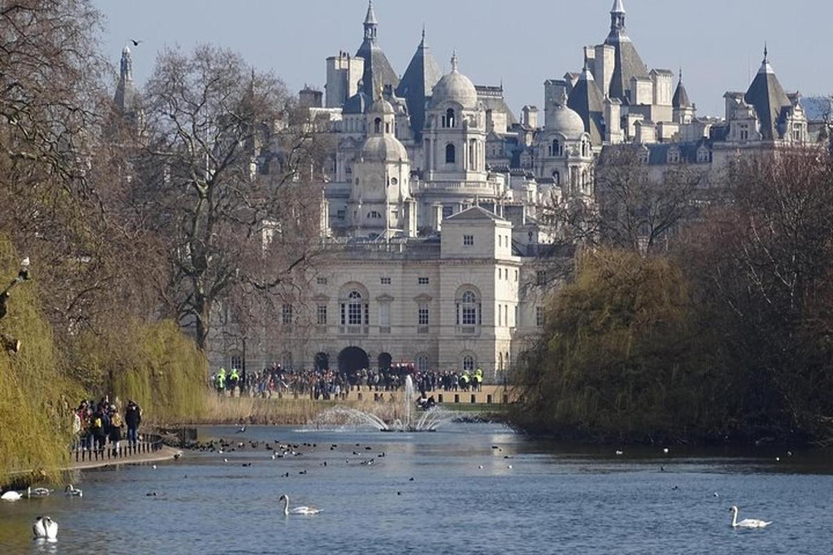 a large building with a pond in front of it