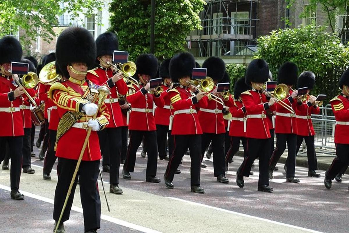 a marching band in red uniforms playing music