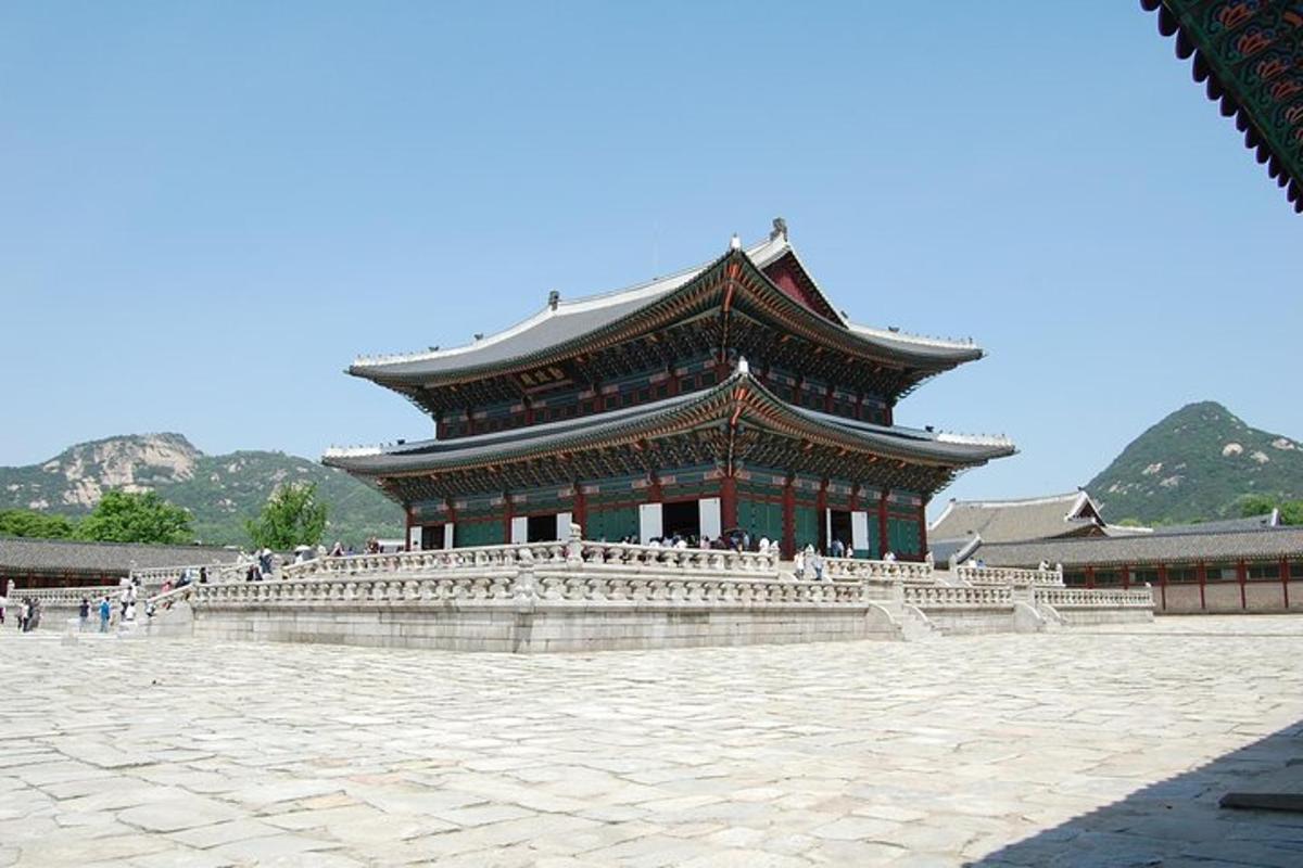 a large building with a roof in a courtyard