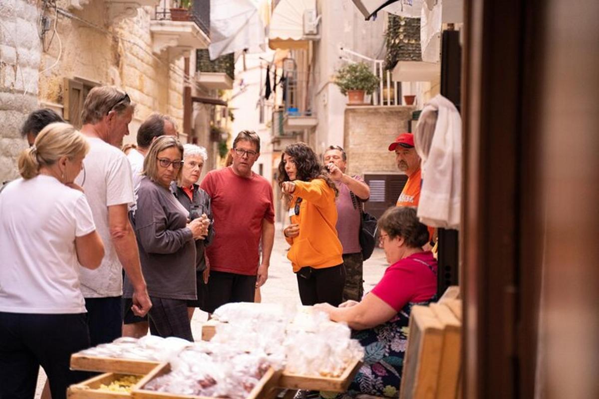 a group of people standing around in a street