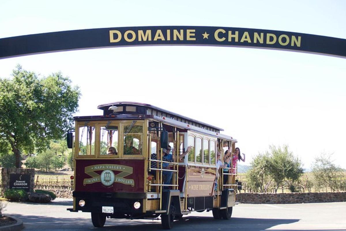 a trolley car with people riding on it