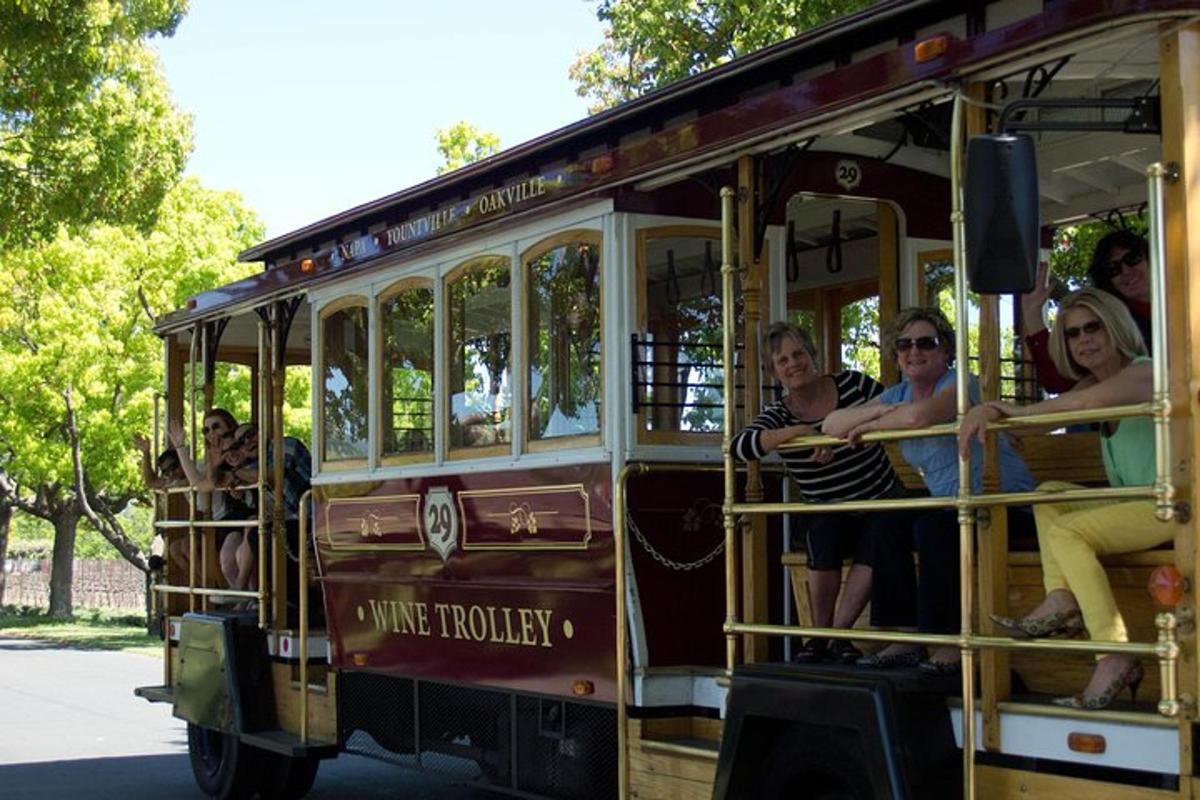a group of people riding on a trolley